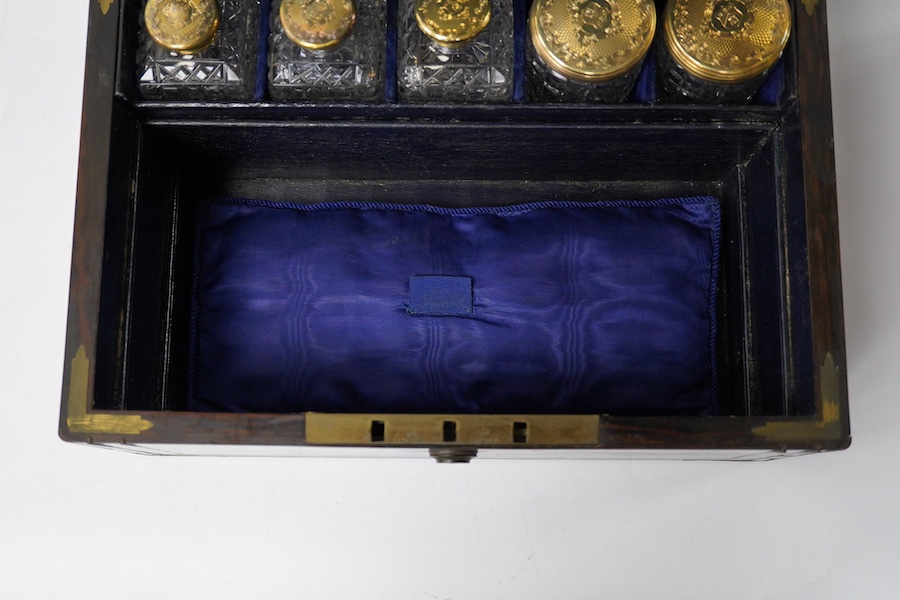 A Victorian brass mounted coromandel travelling toilet box(incomplete), with seven silver gilt lidded glass jars, four hallmarked for Thomas Johnson I, London, 1853 with one lacking glass base and one associated jar with